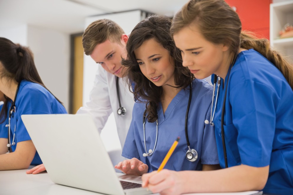 nurses looking at computer
