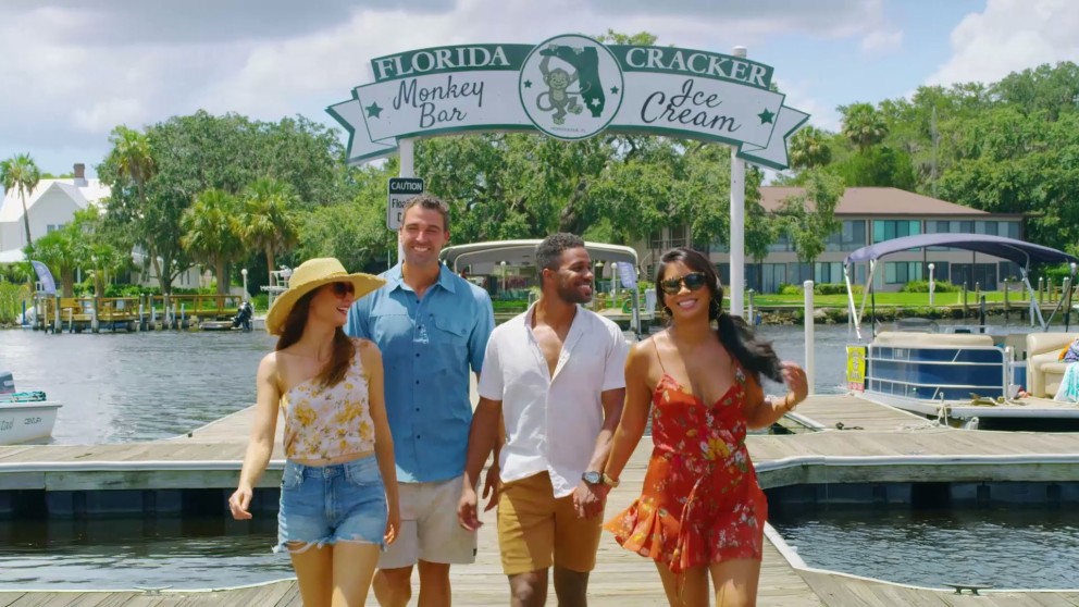people walking down pier